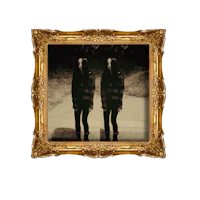 a black and white photo of two people standing in front of a gold frame