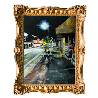a painting of a street scene in a gold frame