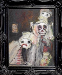 a painting of a clown in a black frame
