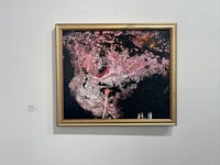 an abstract painting hanging on a wall