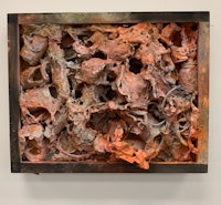 a large piece of rusty metal on a wall