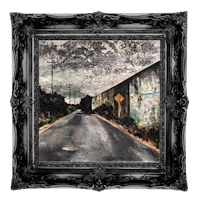 a painting of a road in a black frame